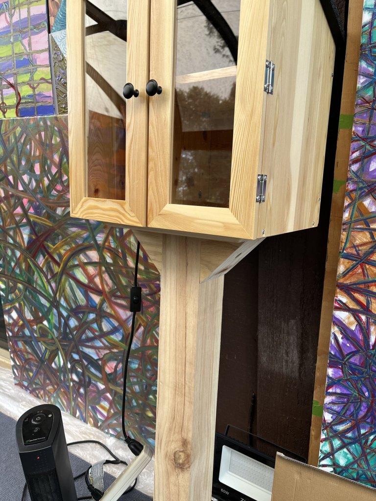 Open Giving Gallery cabinet during the installation process