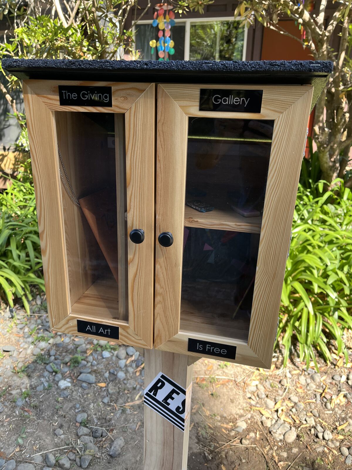 Completed outdoor installation of the handmade Giving Gallery