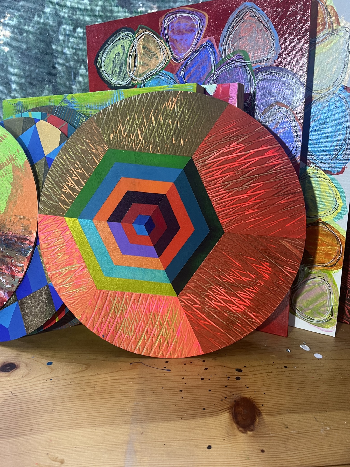 Art Drop #14 (estimated match): Geometries series: circular panel with concentric hexagons and radiating red and gold lines