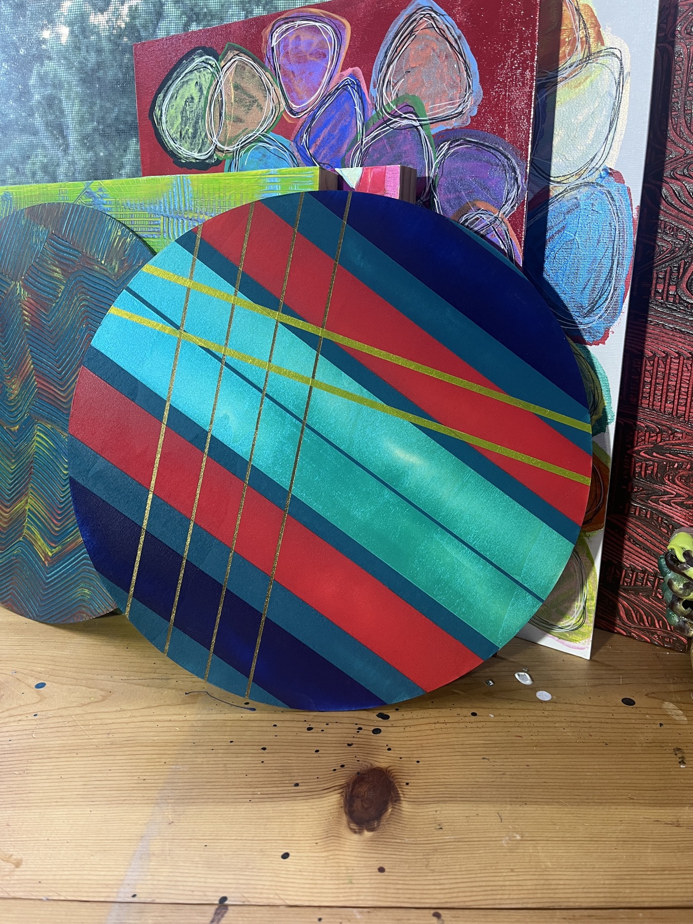 Art Drop #13 (estimated match): Geometries series: circular panel with diagonal red, green, and blue bands